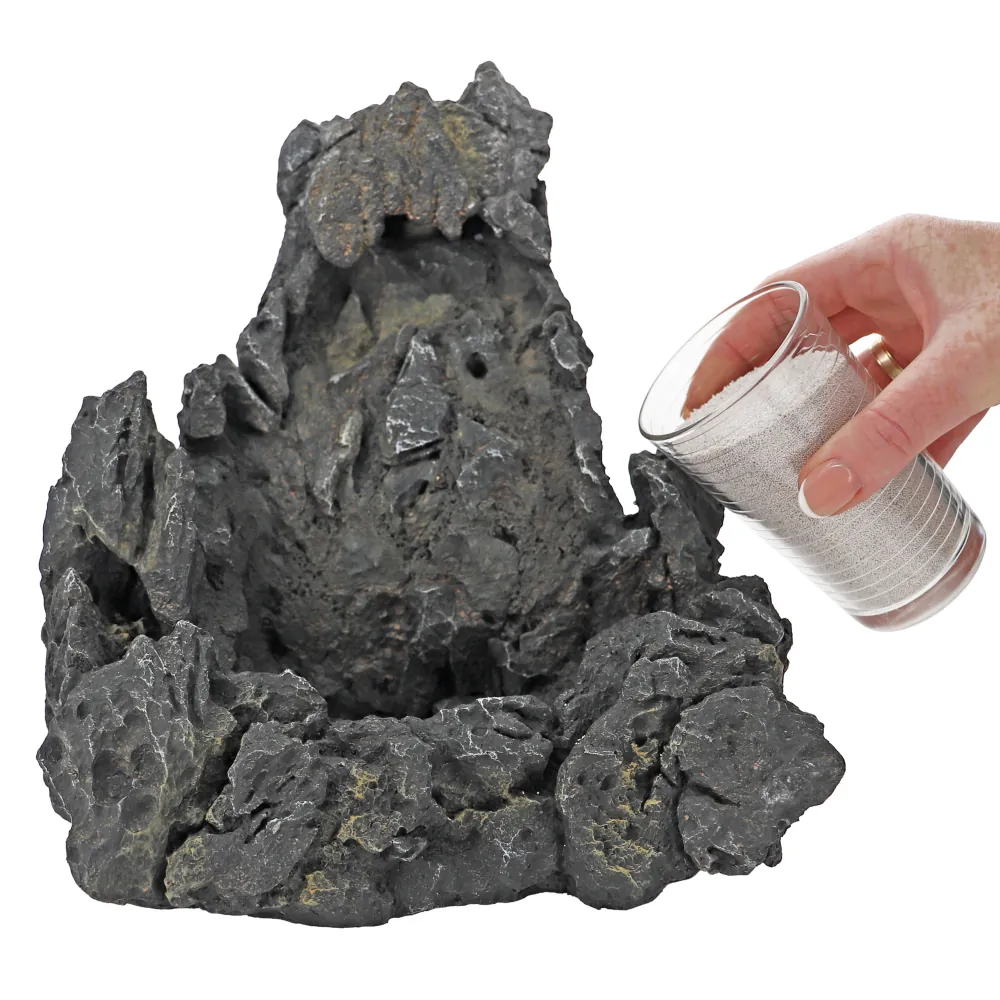 Hobby Sandfall (25,5 × 20 × 26,5 cm) als Aquarium-Deko: künstliche Felsstruktur mit Sandkanal, in die feiner Startsand rieselt und eine unter Wasser laufende Sandkaskade erzeugt; Betrieb mit handelsüblicher Aquarienpumpe, fischverträglich.